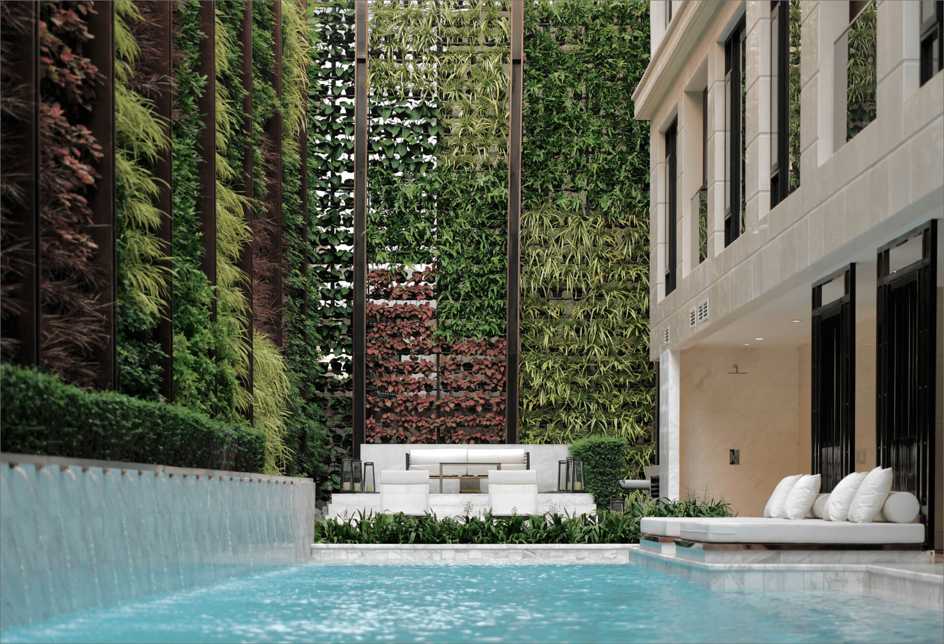 Nivati Thonglor 23 outdoor pool with vertical garden wall and white loungers